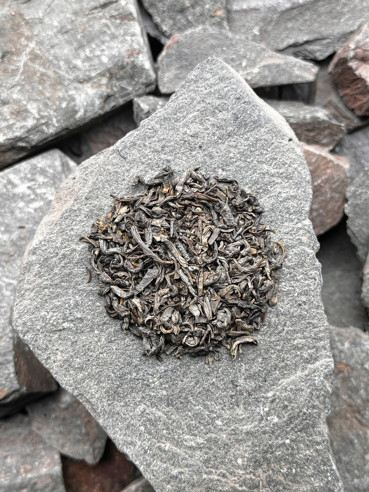 Silver, Green loose leaf green tea, Lucky Dragon on a grey slate arrangement at High Summit Tea Co