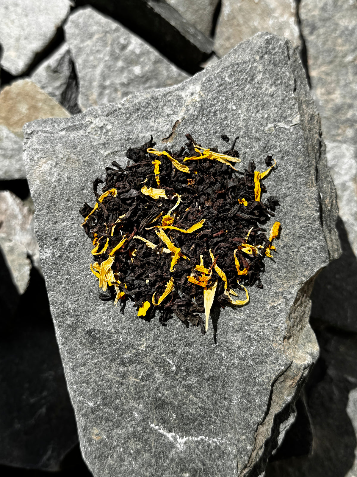 Black Tea with yellow calendula and marigold petals 